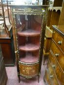 A reproduction French style Kingwood and brass embellished corner cabinet with tulip wood inlay to