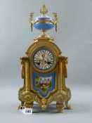 A French style gilt bronze and ormolu mounted mantel clock with Sévres style porcelain dial, gilt