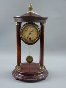 A French stained walnut circular four pillar mantel clock with cast brass pineapple finial, drum