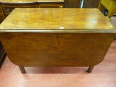 An antique mahogany good size drop leaf table on square chamfered edge supports, 72 cms high, 146