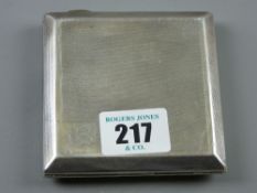 A gent's engine turned square shaped silver cigarette case, 4 ozs, Birmingham 1902