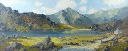 CHARLES WYATT WARREN oil on board - Snowdonia lake scene with cottage and track, signed, 37 x 90