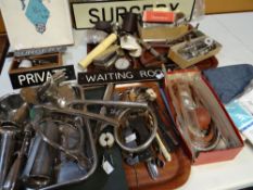 A quantity of loose doctor's surgery examination instruments, sundry surgery door signs and