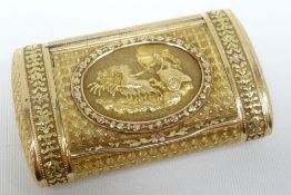 A Swiss three-gold pocket-size snuff-box of rounded-form, the hinged lid with raised Greek chariot