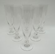 A set of six Lalique champagne-flutes with twisted-knop stems, 18cms