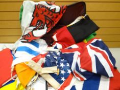 A suitcase containing thirteen linen various National flags and twelve synthetic various