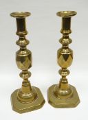 A pair of brass candle-holders 'THE QUEEN OF DIAMONDS', 29cms high