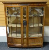 An Edwardian mahogany bow-front two door china-cabinet, circa 1915, 119cms