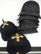 A quantity of blue cloth helmets