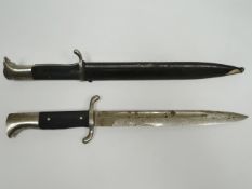 A German dress bayonet by E. Pack & Sohne, Solingen in scabbard marked Berg & Co. together with
