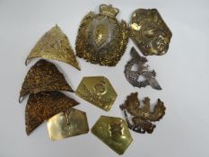 A quantity of metal helmet plates and identification plates