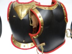 A reproduction cavalry breast plate together with plumage pieces and an Officer's Mounted Infantry
