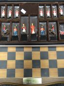 A boxed chess set with hand painted cast metal British and French Waterloo pieces (complete)
