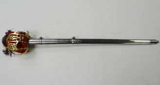A reproduction Scottish basket hilt sword in scabbard