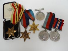 Six WWII medals including an African Star in Knight & Son jewellery box