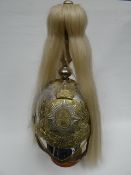 A cavalry parade helmet for other ranks with plate, plumage, chinscale strap and liner