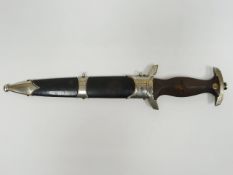 A German Third Reich Nazi NSKK dagger with RZM 1939 marking on blade with motto in scabbard eagle