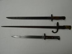 Three bayonets without scabbards