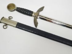 A German Third Reich Luftwaffe sword with SMF Solingen maker's mark on blade sheathed in blue