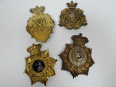 Four regimental helmet plates