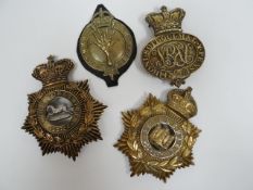 Four regimental helmet plates