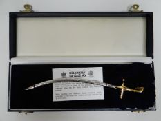 A boxed presentation miniature Wilkinson Sword mameluke letter opener