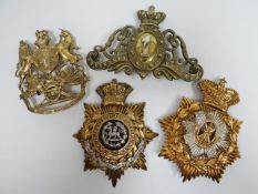 Four regimental helmet plates