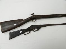 A long barrel percussion musket with lock inscribed 'Jas Balleny' together with a Daisy single