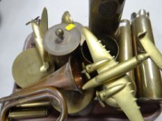 A quantity of trench art, horse brasses, bugle and artillery shells