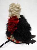 A Scottish Highlanders feathered headdress with liner marked 'Thos Gordon & Co., Glasgow'