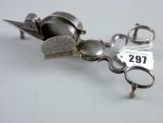 A pair of Georgian steel Warr patent candle snuffer and trimmer on three shaped supports