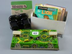 A Russian made clockwork tinplate bus station, three boxed 8mm home movies, a boxed bakelite