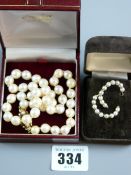 A natural pearl necklace of non-graduated pearls with a fine nine carat gold scrolled clasp with