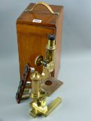 A mahogany cased all brass microscope by Ross with four supplementary lenses