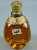 A sealed bottle of Dimple Haig Whisky, thirteen and one third fluid ozs, purchased in 1956