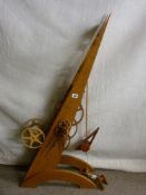 A 20th Century hand crafted oak inclination clock with winder, possibly built after a design by