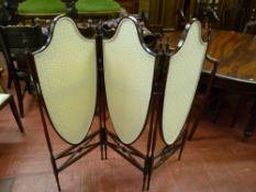 An excellent quality three fold rosewood dressing screen with shield shaped floral upholstered
