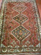 An antique Nomadic Afshar rug, c1830-1860, red ground with cream border, geometric design centre,
