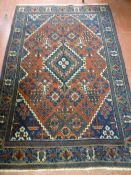 An antique Nomadic Josheghan rug, c1840, wide bordered blue and red with geometric design, 200 x 130