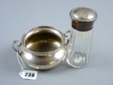 A twin handled Continental silver porringer bowl on a shallow pedestal and of waisted form, 5.2