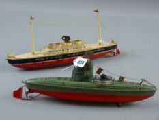 A tinplate clockwork model of a twin masted cruise liner, marked to the base 'Made in Germany, US