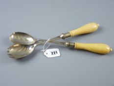 A pair of ivory handled white metal salad servers
