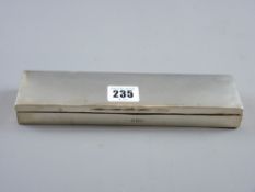An oblong silver wood lined lidded pen box with slender writing nib, Birmingham 1905