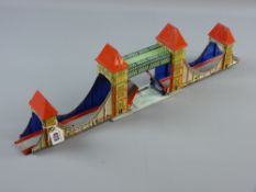 A Technofix tinplate model of Tower Bridge, London, marked 'Made in US Zone, Germany', 15 x 56 cms