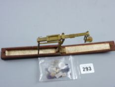 A set of mahogany cased brass sovereign and half sovereign scales by Houghton & Son, Ormskirk and