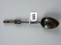 A primitive lovespoon with twist handle and heart motif