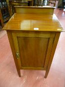 An Edwardian mahogany single door night cabinet with boxwood line inlay and shallow rail back, 84