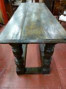 An 18th Century refectory table/server with three plank adzed top having moulded edging, carved