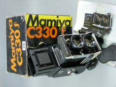 A Mamiya C330 Professional 6x6 twin lens Reflex camera, boxed with instructions and carrying strap