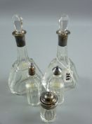 A pair of heavy glass narrow necked bottles on oblong form with shaped corners and star cut bases